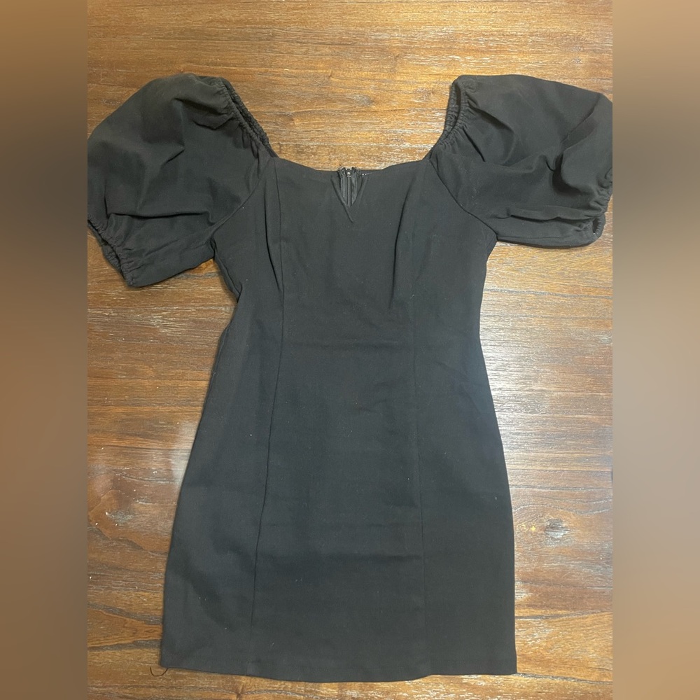 These Three Boutique. Black ruffle sleeve dress